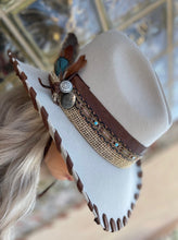 Load image into Gallery viewer, Tailored West Embellished Mist Hickstead Bailey Western Hat with Custom Brown Leather Band and Stitching, feathers, conchos, burlap, braid