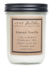Load image into Gallery viewer, A 16 oz glass jar candle with a black metal screw-on lid and a brown kraft paper label that reads '1803 Candle Co. Almond Vanilla'.

