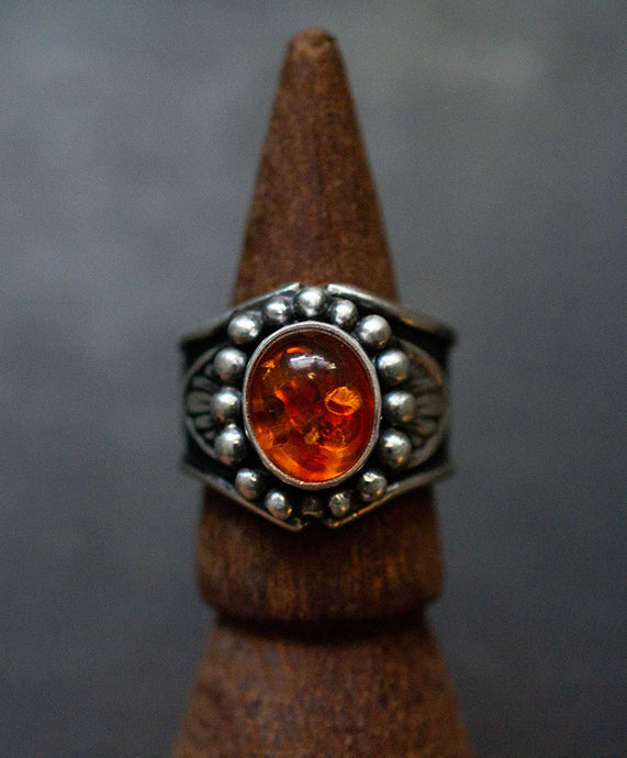 Handcrafted Amber Heavy Signet Ring with Sterling Silver Details made with Old World Artisan Silversmithing. Handcrafted in Colorado