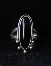 Load image into Gallery viewer, Handcrafted Black Onyx Dharma Ring with Sterling Silver Details made with Old World Artisan Silversmithing. Handcrafted in Colorado
