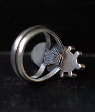 Load image into Gallery viewer, Handcrafted Black Onyx Dharma Ring with Sterling Silver Details made with Old World Artisan Silversmithing. Handcrafted in Colorado
