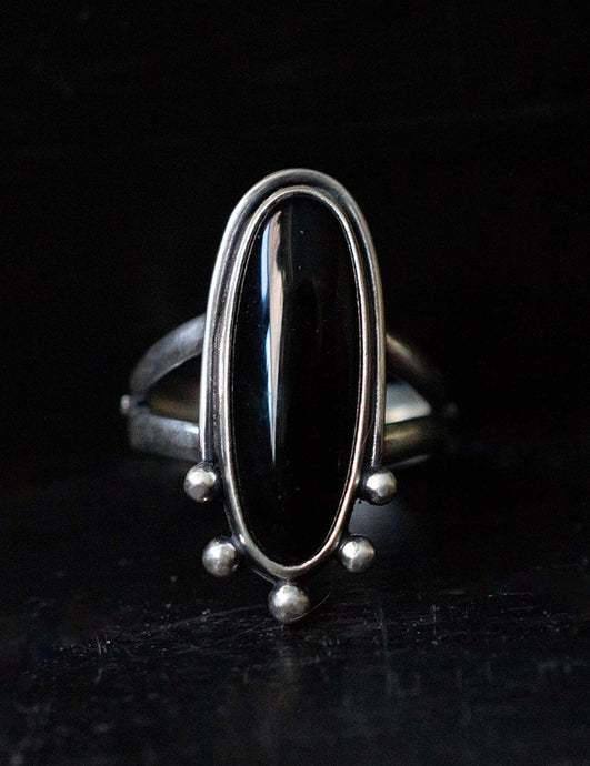 Handcrafted Black Onyx Dharma Ring with Sterling Silver Details made with Old World Artisan Silversmithing. Handcrafted in Colorado