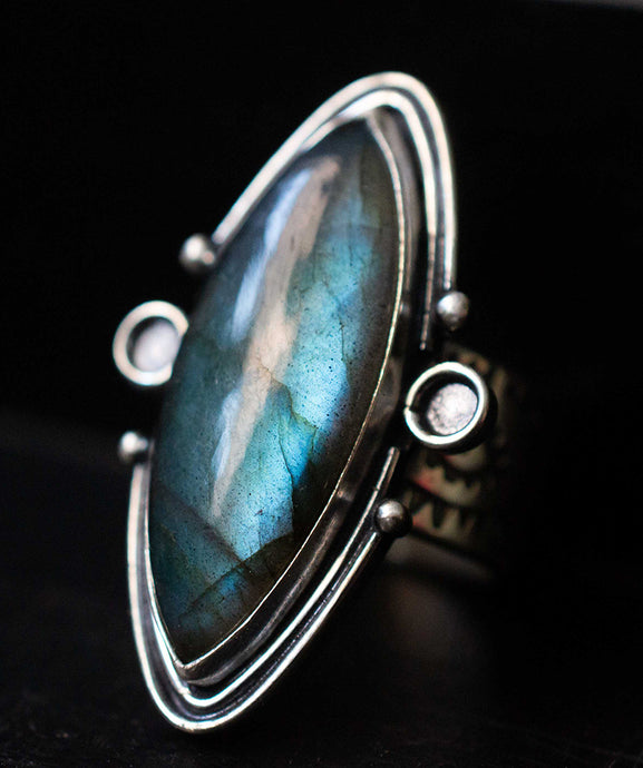 Handcrafted Labradorite Circe Ring with Sterling Silver Details made with Old World Artisan Silversmithing. Handcrafted in Colorado